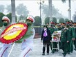 Cérémonie d'inhumation de restes de six soldats volontaires vietnamiens tombés au Laos