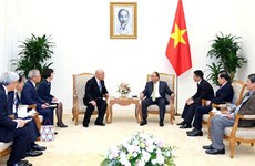 Le PM Nguyen Xuan Phuc reçoit un conseiller du Premier ministre japonais