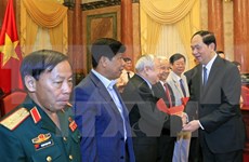 Rencontre du président Tran Dai Quang avec des soldats volontaires vietnamiens au Cambodge 