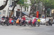 La plupart des Vietnamiens respectent le port du casque de moto