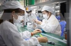 La BM met en garde contre l'impact continu de COVID-19 sur l'industrie manufacturière du Vietnam