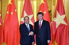 Entrevue entre le PM Nguyen Xuan Phuc et le dirigeant chinois Xi Jinping