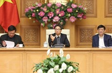 Le vice-PM Vu Duc Dam préside une réunion sur les mesures face au nCoV