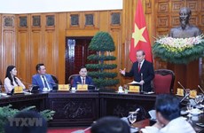 Le vice-PM Truong Hoà Binh honore les hommes d’affaires illustres