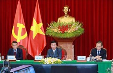 Parti : Entretien en ligne entre des responsables vietnamien et laotien