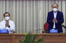 Le président Nguyên Xuân Phuc souligne le décollage économique de Hoc Môn et Cu Chi