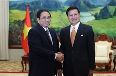 Le PM Pham Minh Chinh rencontre le secrétaire général du Parti et président du Laos