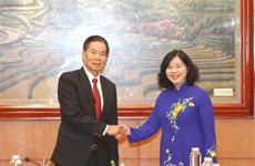 Le Vietnam et le Laos échangent des expériences sur la mobilisation des masses