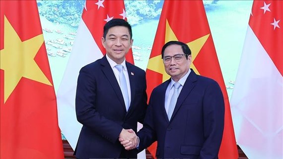 Le Premier ministre Pham Minh Chinh reçoit le président du Parlement de Singapour Tan Chuan-Jin