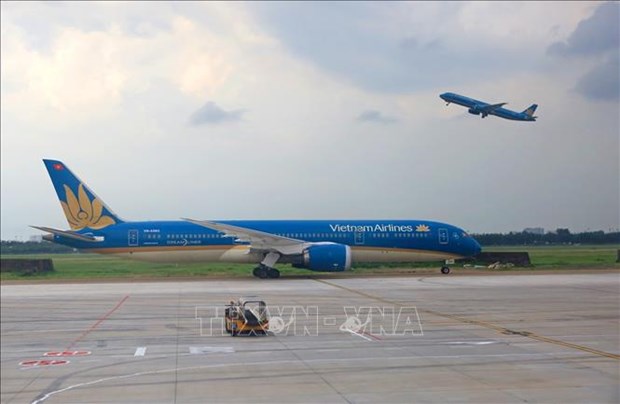 Vietnam Airlines assiste les passagers en raison de l’epidemie de COVID 19 hinh anh 1