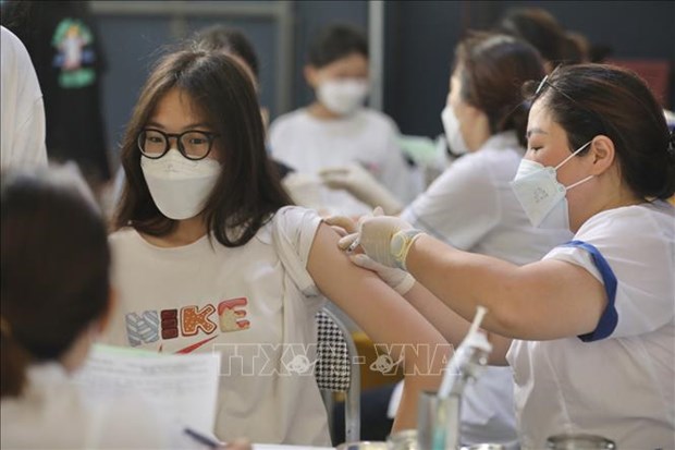 Hanoi demande une utilisation rapide et efficace des vaccins anti-COVID-19 hinh anh 1