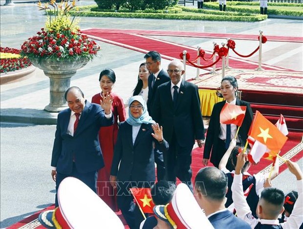 La presse singapourienne salue la visite au Vietnam de la presidente Halimah Yacob hinh anh 2
