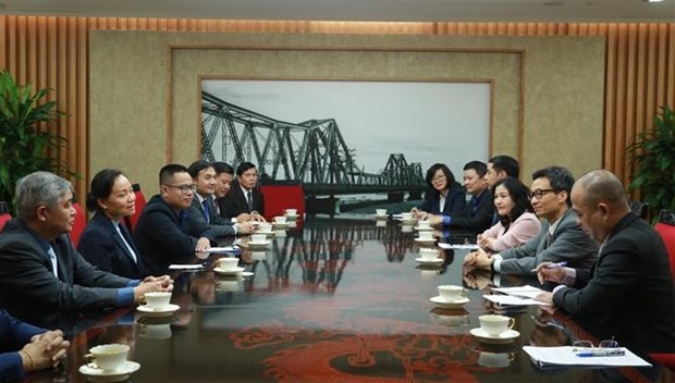 Le vice-Premier ministre Vu Duc Dam recoit la ministre lao du Travail et du Bien-etre social hinh anh 1