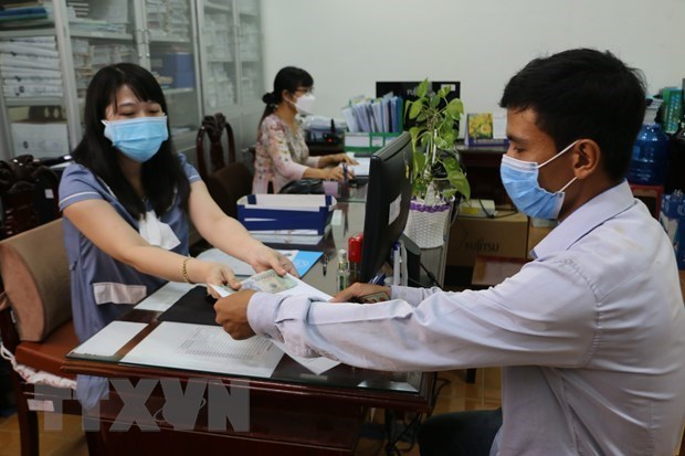 Hanoi aide les personnes impactees par la pandemie avec plus de 3.000 milliards de dongs hinh anh 1