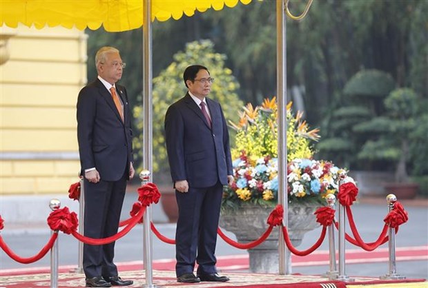 Ceremonie d'accueil du Premier ministre malaisien au Vietnam hinh anh 3