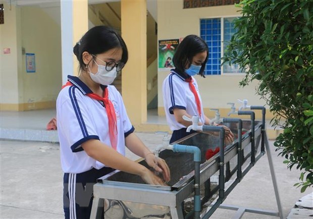 Les eleves de Ho Chi Minh-Ville retournent a l'ecole au debut de mars hinh anh 1