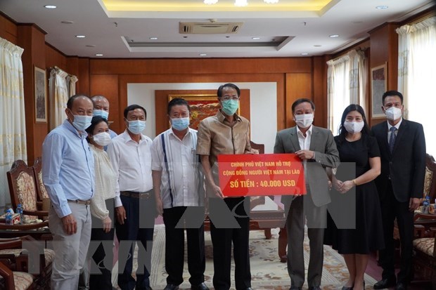 COVID-19 : Le gouvernement vietnamien continue d'assister les Viet kieu au Laos hinh anh 1