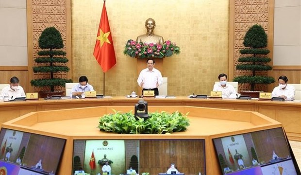 Le Premier ministre Pham Minh Chinh preside la reunion periodique du gouvernement en aout hinh anh 1