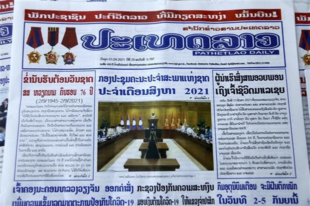 La presse laotienne loue les realisations de developpement du Vietnam hinh anh 1