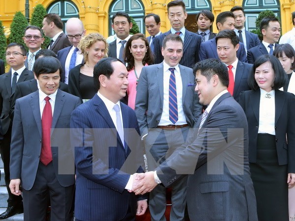 Le chef de l’Etat vietnamien recoit une delegation d’entreprises internationales hinh anh 1