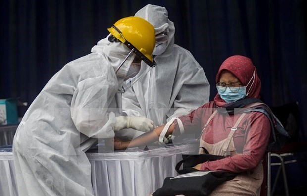 COVID-19: L’Indonesie enregistre son plus grand nombre de cas de contamination en une journee hinh anh 1