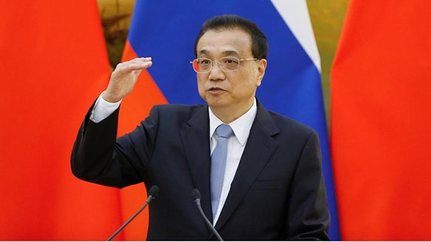 Le Premier ministre chinois appelle a la cooperation et la solidarite pour lutter contre le Covid-19 hinh anh 1