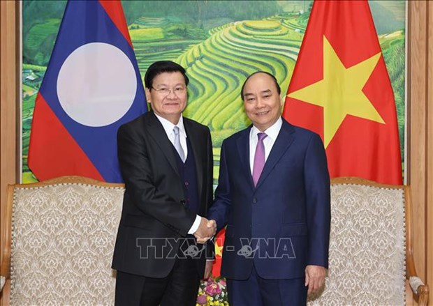 Le Premier ministre lao termine sa visite au Vietnam hinh anh 1