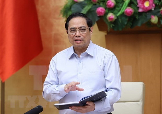 Le Premier ministre Pham Minh Chinh appelle a s’unir pour vaincre l’epidemie de Covid-19 hinh anh 1