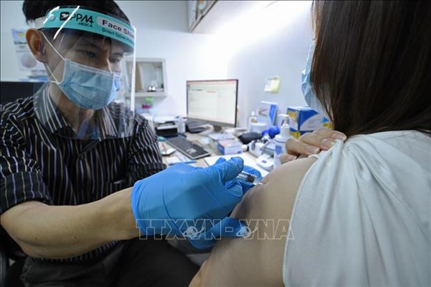 Singapour est le leader mondial du taux de couverture vaccinale contre le COVID-19 hinh anh 1