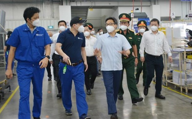 Le vice-Premier ministre Vu Duc Dam inspecte des activites de production a Ho Chi Minh-Ville hinh anh 1