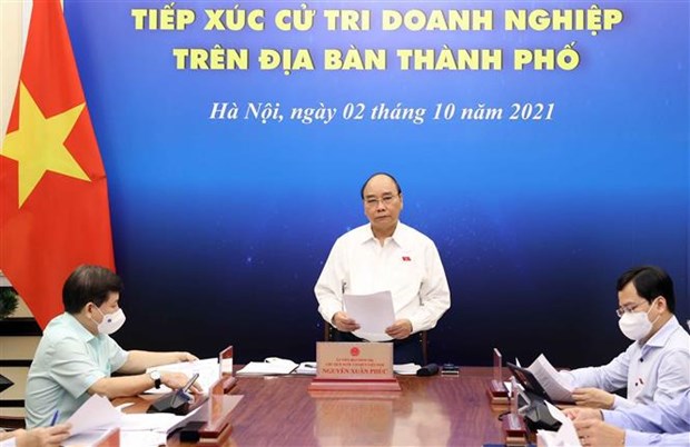 Le president Nguyen Xuan Phuc a l’ecoute d’hommes d’affaires de Ho Chi Minh-Ville hinh anh 1