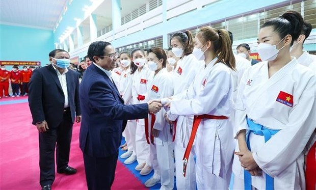 Le Premier ministre Pham Minh Chinh inspecte les preparatifs pour les SEA Games 31 hinh anh 2