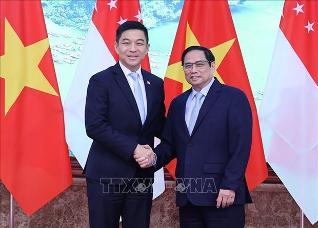 Le Premier ministre Pham Minh Chinh recoit le president du Parlement de Singapour Tan Chuan-Jin hinh anh 1
