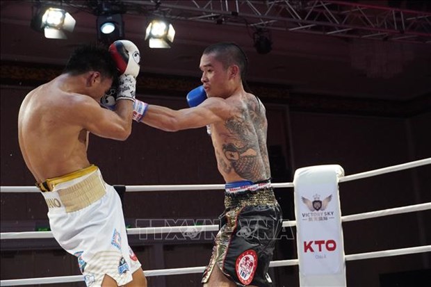 Le boxeur Dinh Hong Quan conserve sa ceinture IBF en Asie hinh anh 2