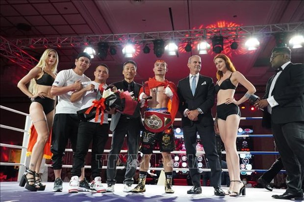 Le boxeur Dinh Hong Quan conserve sa ceinture IBF en Asie hinh anh 1