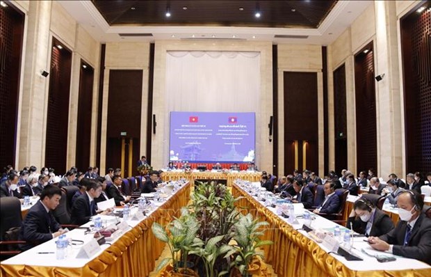 Le secretaire general du PPRL et president lao recoit une delegation du PCV hinh anh 1