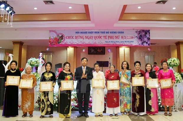 Les femmes vietnamiennes au Laos fetent leur Journee hinh anh 1