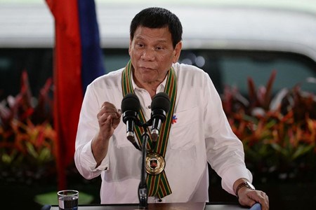 Le president des Philippines en visite en Chine hinh anh 1