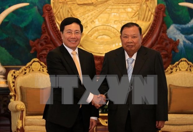 Le vice-PM et ministre des AE Pham Binh Minh en visite officielle au Laos hinh anh 1