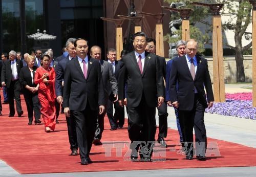 Le president Tran Dai Quang termine sa visite d'Etat en Chine hinh anh 1