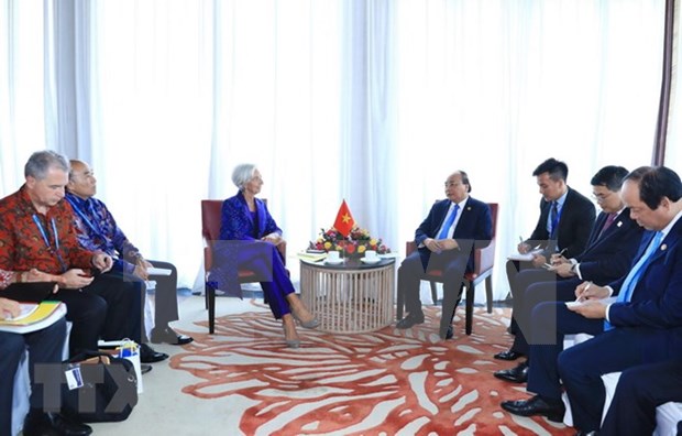 Le PM Nguyen Xuan Phuc rencontre la directrice generale du FMI a Bali hinh anh 1