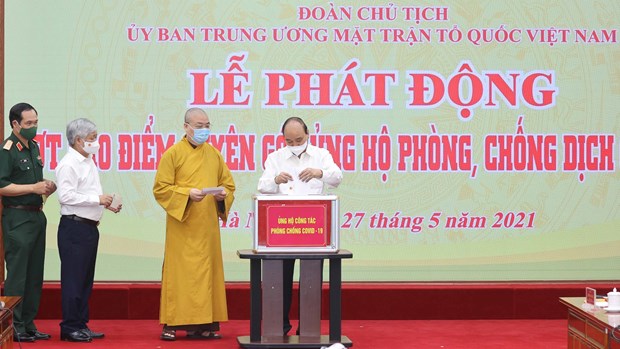 Le president Nguyen Xuan Phuc appelle a la force de la nation dans la lutte anti-COVID-19 hinh anh 1