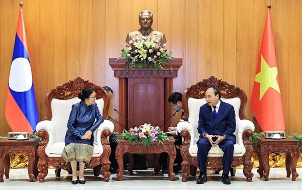 Activites du president vietnamien Nguyen Xuan Phuc au Laos hinh anh 2