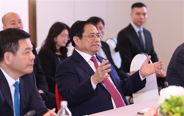 Le Premier ministre Pham Minh Chinh participe au Forum et a l'Exposition sur l’economie verte 2022 hinh anh 1