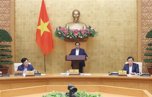 Le Premier ministre preside la reunion de decembre du gouvernement hinh anh 1