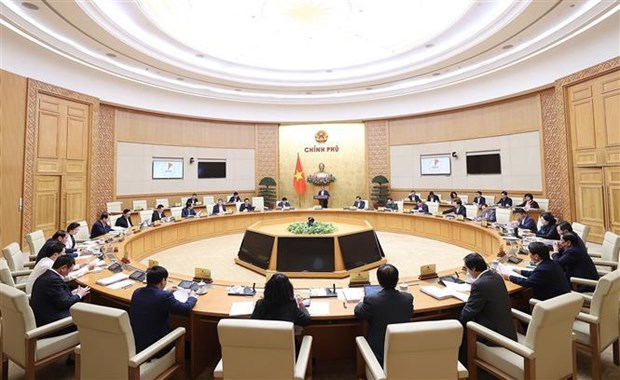 Le Premier ministre preside la reunion de decembre du gouvernement hinh anh 2