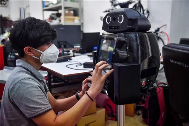 COVID-19 : la Thailande developpe des robots medicaux hinh anh 1
