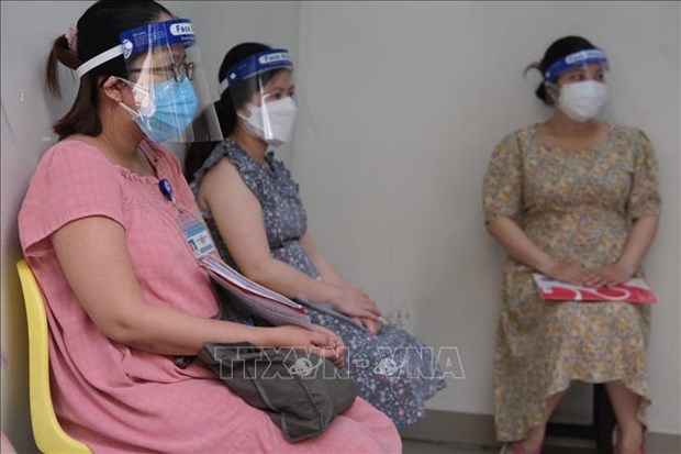 Ho Chi Minh-Ville : vaccination contre le COVID-19 pour les femmes enceintes de plus de 13 semaines hinh anh 1