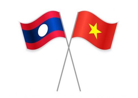 L'ambassade du Laos presente ses vœux de Nouvel An a son homologue vietnamien a Singapour hinh anh 1