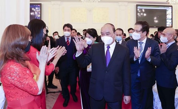 Le president Nguyen Xuan Phuc rencontre la communaute vietnamienne en Russie hinh anh 1